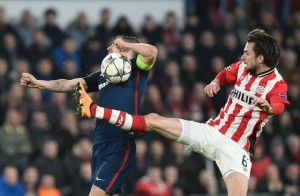 PSV Eindhoven’s midfielder Davy Propper tackles Atletico Madrid’s midfielder Gabi during the UEFA Champions League round of 16 first leg football match between PSV Eindhoven and Atletico Madrid at the Philips Stadium in Eindhoven on Thursday. AFP PHOTO 