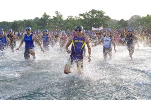 Participants plunge into the swim segment of last year’s Tri Ilocos Norte 3.  CONTRIBUTED PHOTO