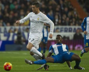 Real Madrid’s Portuguese forward Cristiano Ronaldo (left) vies with Espanyol’s Senegalese midfielder Pape Diop during the Spanish league football match Real Madrid CF vs RCD Espanyol at the Santiago Bernabeu stadium in Madrid on Monday. AFP PHOTO