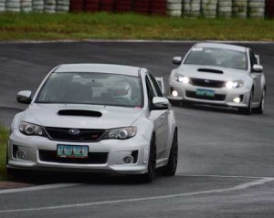 The two Subaru Impreza STis battle it out in the Turbo+ Class of the Touge Battle round 2 staged at the Batangas Racing Circuit on Sunday. CONTRIBUTED PHOTO