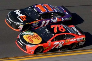 Martin Truex Jr., and Denny Hamlin driver their Toyotas to the finish line of the Daytona 500 at Daytona International Speedway on February 21, 2016 in Daytona Beach, Florida. AFP PHOTO 