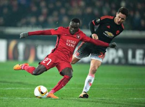 FC Midtjylland’s forward Pione Sisto (left) scores the 1-1 goal past Manchester United’s Spanish midfielder Ander Herrera during the  UEFA Europa League Round of 32 football match between Manchester United and FC Midtjylland in Hernin on Friday. AFP PHOTO 