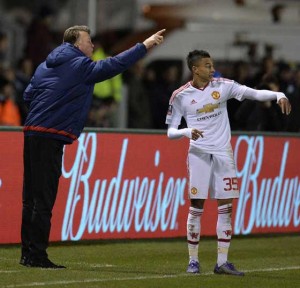 Manchester United’s Dutch manager Louis van Gaal (left) gestures towards Manchester United’s English midfielder Jesse Lingard during the English FA Cup fifth round football match between Shrewsbury Town and Manchester United at the Greenhous Meadow stadium in Shrewsbury, western England on Tuesday. AFP PHOTO 