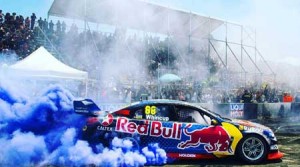 Jaime Whincup does a burnout exhibition before fans of the V8 Supercars championship in Australia. JAMIEWHINCUP.COM.AU