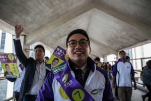 ELECTION WINNER Alvin Yeung (C) of the established pro-democracy Civic Party walks on an overpass with his supporters as he campaigns for the New Territories East by-election in Hong Kong on Feb. 28. Yeung took first place in a six-way contest for the New Territories East seat - which opened up after a prominent prodemocracy politician stepped down - in the north of Hong Kong, which saw a strong showing from a young “localist” candidate. AFP PHOTO