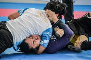 Karlo Sevilla (top) applies a north-south choke against Michael Rey during the 2016 Philippine International Open Brazilian Jiu-jitsu Gi/No Gi held recently at the Mall of Asia activity center in Pasay City. PHOTO COURTESY OF BRAZILIAN JIU JITSU FEDERATION OF THE PHILIPPINES