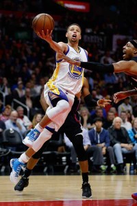 Stephen Curry (No. 30) of the Golden State Warriors drives to the basket past Paul Pierce of the Los Angeles Clippers during the first half of a game at Staples Center on Saturday (Sunday in Manila) in Los Angeles, California. AFP PHOTO