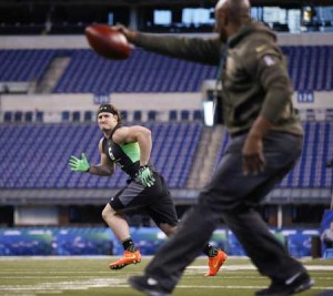 Defensive lineman Joey Bosa of Ohio State participates in a drill during the 2016 NFL Scouting Combine at Lucas Oil Stadium on Monday in Indianapolis, Indiana. AFP PHOTO