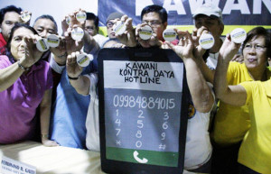 NO TO CHEATING Government employees launch the “Kwani Kontra Daya,” a campaign against election fraud and poll-related violence in Quezon City on Wednesday. The group vowed to expose attempts to use public resources and personnel to influence results of the elections. PHOTO BY MIKE DE JUAN 