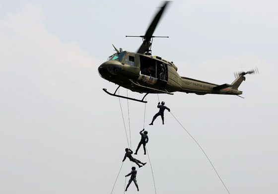 Women rappel from a helicopter during a training held by the Philippine Coast Guard’s Special Operation Group in Manila. PHOTO BY RUSSEL PALMA