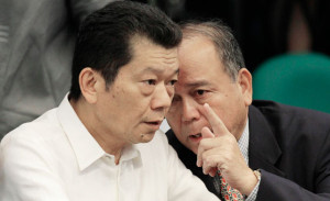 AN EARFUL OF ADVICE Kim Wong consults his lawyer during a lull in the Senate inquiry. PHOTO BY CESAR DANCEL 