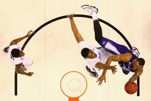 Joel Bolomboy No.21 of the Weber State Wildcats drives to the basket against James Farr No.2 of the Xavier Musketeers in the first half of their game during the first round of the 2016 NCAA Men’s Basketball Tournament at Scottrade Center on March 18, 2016 in St Louis, Missouri. AFP PHOTO