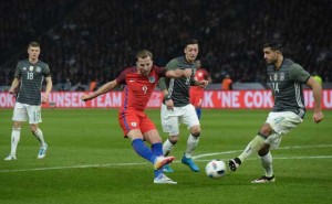 England’s striker Harry Kane (second left) shoots past Germany’s midfielder Emre Can (right) during the friendly football match Germany v England at the Olympic Stadium in Berlin on Sunday. AFP PHOTO