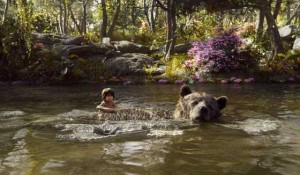 Mowgli, a man-cub raised in the jungle, with the free-spirited bear Baloo 