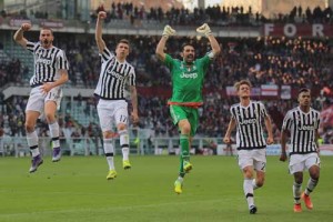 Juventus’ goalkeeper Gianluigi Buffon (center) celebrates with teammates at the end of the Italian Serie A football match Torino vs Juventus on Monday at the “Olympic Stadium” in Turin. AFP PHOTO