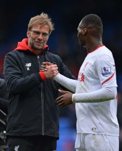 Liverpool’s German manager Jurgen Klopp (left) congratulates Liverpool’s Zaire-born Belgian striker Christian Benteke after the English Premier League football match between Crystal Palace and Liverpool at Selhurst Park in south London on March 6, 2016. Liverpool won the game 2-1.  AFP PHOTO 