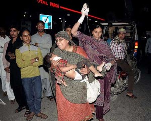 Relatives bring an injured child to the hospital in Lahore. AFP PHOTO