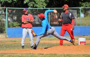 Cuban national baseball team members train at the Latino americano stadium in Havana, on Monday. Cubans look forward to the baseball game between the US Tampa Bay Rays team and the Cuban team, which will take place on March 22, with the presence of US President Barack Obama. AFP PHOTO