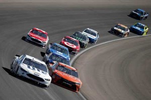 Brad Keselowski, driver of the No. 2 Miller Lite Ford, leads Carl Edwards, driver of the No. 9 Arris Toyota, during the NASCAR Sprint Cup Series Kobalt 400 at Las Vegas Motor Speedway on Monday in Las Vegas, Nevada. AFP PHOTO