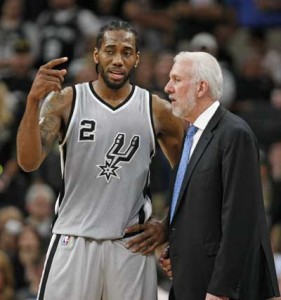 Kawhi Leonard No.2 of the San Antonio Spurs talks with head coach Gregg Popovich at AT&T Center in San Antonio, Texas. AFP PHOTO