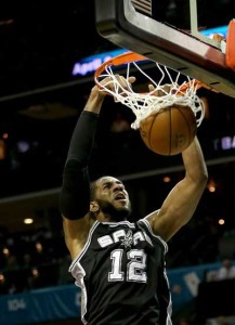 LaMarcus Aldridge No.12 of the San Antonio Spurs dunks the ball during a game at Time Warner Cable Arena in Charlotte, North Carolina. AFP PHOTO