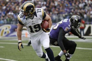 Wes Welker of the St. Louis Rams carries the ball past Tray Walker (right) of the Baltimore Ravens at M&T Bank Stadium in Baltimore, Maryland. AFP PHOTO