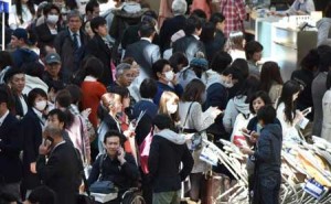 People wait in long queues to check in and get new reservations in front of counters for Japanese carrier All Nippon Airways. AFP PHOTO