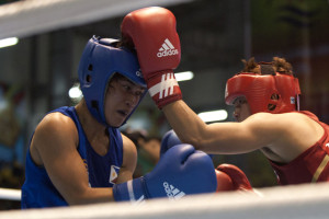 Sopida Satumrum (right) of Thailand and Maricris Igam (left) of Philippines compete during their boxing match at the 27th Southeast Asian Games in Naypyidaw on December 12, 2013. The AIBA changed the rules for amateur fighters and now boxers will fight without headgear at the Rio Games. The rule change does not apply to female fighters, who will continue to use head  protection. AFP FILE PHOTO 