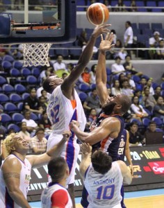 Orinze Onauku No.5 of Meralco drives against Al Thornton No.12 of NLEX during a PBA Commissioner’s Cup game at the Smart Araneta Coliseum in Quezon City on Friday. PHOTO BY CZEASAR DANCEL 