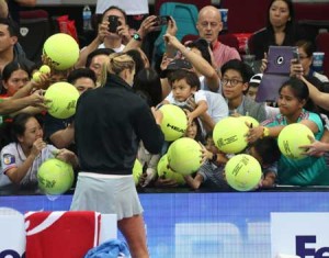 Maria Sharapova greets her Filipino fans after a match against Kristina Mladenovic in the International Premier Tennis league tilt at the Mall of Asia Arena in Pasay City on November 30, 2015. PHOTO BY RENE H. DILAN