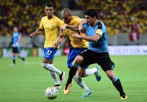 Brazil’s Miranda (center) and Uruguay’s Luis Suarez vie for the ball during their Russia 2018 FIFA World Cup South American Qualifiers’ football match, in Recife, northeastern Brazil, on Saturday. AFP PHOTO