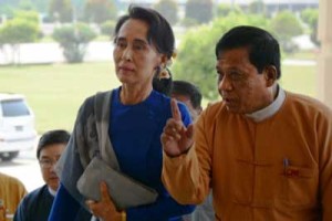 Myanmar democracy icon Aung San Suu Kyi (left) is escorted by National League for Democracy (NLD) senior leader and lawmaker Zaw Myint Maung (R) as she arrives at the parliament in Naypyidaw on March 1, 2016. Myanmar’s parliament will bring forward a vote for the next president to March 10, it was announced on March 1 leaving little time for Aung San Suu Kyi to strike a deal to let her take the top office. The democracy icon is currently banned from becoming president under the junta-era constitution. AFP PHOTO