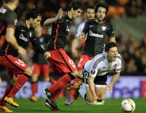 Athletic’s midfielder Mikel San Jose (second left) vies with Valencia’s forward Santi Mina (right bottom) during the UEFA Europa League round of 16 second leg football match between Valencia CF vs Athletic Club de Bilbao at the Mestalla stadium in Valencia on Friday. AFP PHOTO 