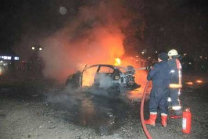 Firefighters extinguishing a burning car after a blast in Ankara. AFP PHOTO