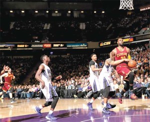 LeBron James No.23 of the Cleveland Cavaliers is fouled by Caron Butler No.31 of the Sacramento Kings at Sleep Train Arena on Thursday in Sacramento, California. AFP PHOTO 