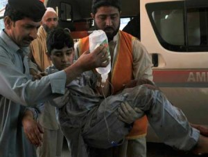 An injured boy is rushed to hospital in Peshawar after a suicide bombing on March 7 in the town of Shabqadar Hasham Ahmed. AFP PHOTO