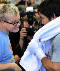 Coach Freddie Roach (left) talks to his top pupil Manny Pacquiao during training.  AFP FILE PHOTO