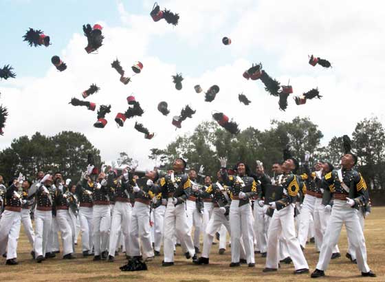 Philippine Military Academy graduates toss their chaku caps up into the air after graduation ceremonies at the PMA in Baguio City. Kristian Daeve Gelacio Abiqui, who topped the Gabay-Laya Class of 2016, received the Presidential Saber Award. PHOTO BY THOM PICAÑA