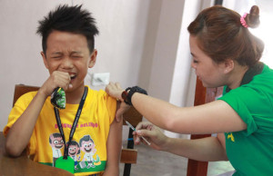 OUCH A boy grimaces as he gets a shot of the anti-dengue vaccine at the Parang Elementary School in Marikina City. PHOTO BY RUY L. MARTINEZ 