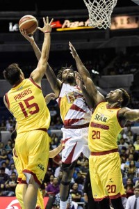 THREE-WAY COLLISION Tyler Wilkerson of San Miguel Beer challenges the defense of Ricardo Ratliffe and Marc Pingris of Purefoods Star Hotshots during the PBA Commissioner’s Cup quarterfinals at the Smart Araneta Coliseum on Wednesday. PHOTO BY CZEASAR DANCEL