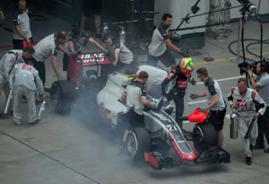 Haas F1 Team’s Brazilian driver Esteban Gutierrez gets out of his smoking car during the second practice session at the Formula One Chinese Grand Prix in Shanghai on Friday. Unlike his French team-mate Romain Grosjean, Gutierrez has yet to contribute a point for Haas F1. AFP PHOTO