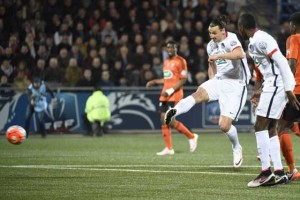 Paris Saint-Germain’s Swedish forward Zlatan Ibrahimovic (third right) kicks to score during the French Cup semi-final football match between Lorient (FCL) and Paris Saint-Germain (PSG) at Moustoir stadium in Lorient, western France, on Wednesday. AFP PHOTO