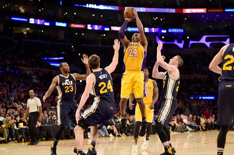 Kobe Bryant #24 of the Los Angeles Lakers goes up for a shot against Jeff Withey #24 of the Utah Jazz in the fourth quarter at Staples Center on Wednesday (Thursday in Manila) in Los Angeles, California. Harry How/Getty Images/AFP