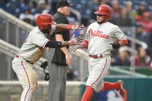 Odubel Herrera No.3 and Freddy Galvis No.13 of the Philadelphia Phillies score on a double Cameron Rupp No.29 of the Philadelphia Phillies (not pitched) in the ninth inning during a baseball game against the Washington Nationals at Nationals Park on Friday in Washington, D.C.  AFP PHOTO