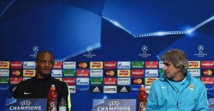 Manchester City’s Belgian defender Vincent Kompany (left) and Manchester City’s Chilean manager Manuel Pellegrini (right) attend a press conference in Manchester, northwest England on Tuesday ahead of their UEFA Champions League semi-final, first leg football match against Real Madrid on Wednesday. AFP PHOTO