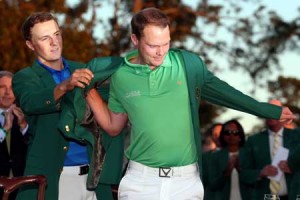 Jordan Spieth of the United States presents Danny Willett of England with the green jacket after Willet won the final round of the 2016 Masters Tournament at Augusta National Golf Club on Monday in Augusta, Georgia. AFP PHOTO