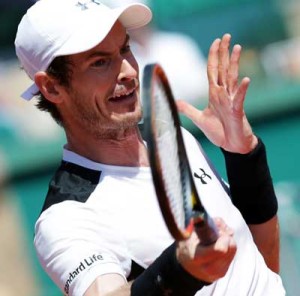 Andy Murray hits a return to Canada’s Milos Raonic during their tennis match at the Monte-Carlo ATP Masters Series tournament on Saturday in Monaco. AFP PHOTO