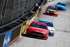 Landon Cassill, driver of the No. 38 Snap Fitness Ford, leads the field ahead of Carl Edwards, driver of the No. 19 Comcast Business Toyota, during the NASCAR Sprint Cup Series Food City 500 at Bristol Motor Speedway over the weekend in Bristol, Tennessee. Cassill would relinquish the lead and finish 22nd in the race. AFP PHOTO