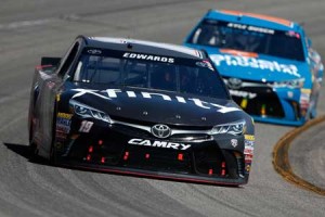 Carl Edwards, driver of the No. 19 XFINITY Toyota, races Kyle Busch, driver of the No. 18 Banfield Toyota, during the NASCAR Sprint Cup Series Toyota Owners 400 at Richmond International Raceway on Monday in Richmond, Virginia. AFP PHOTO