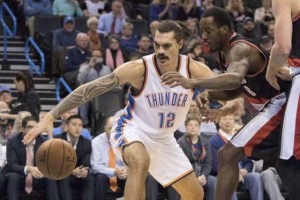 Portland Trail Blazers’ Al-Farouq Aminu (right) trying to recover the ball he knocked away from Oklahoma City Thunder’s Steven Adams on Dec 16, 2015.  AFP FILE PHOTO